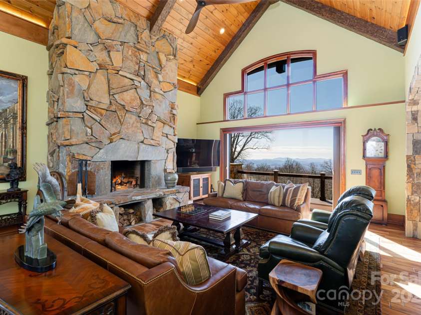 24 Snow Ridge Drive, Hendersonville, NC 28792.  MLS# CAR4239969, YatesRealty ID 7164. Vaulted great room with disappearing doors