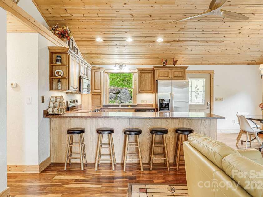 73 Oak Ridge Court, Mars Hill, NC 28754.  MLS# CAR4166537, YatesRealty ID 7165. Extra seating in the kitchen.