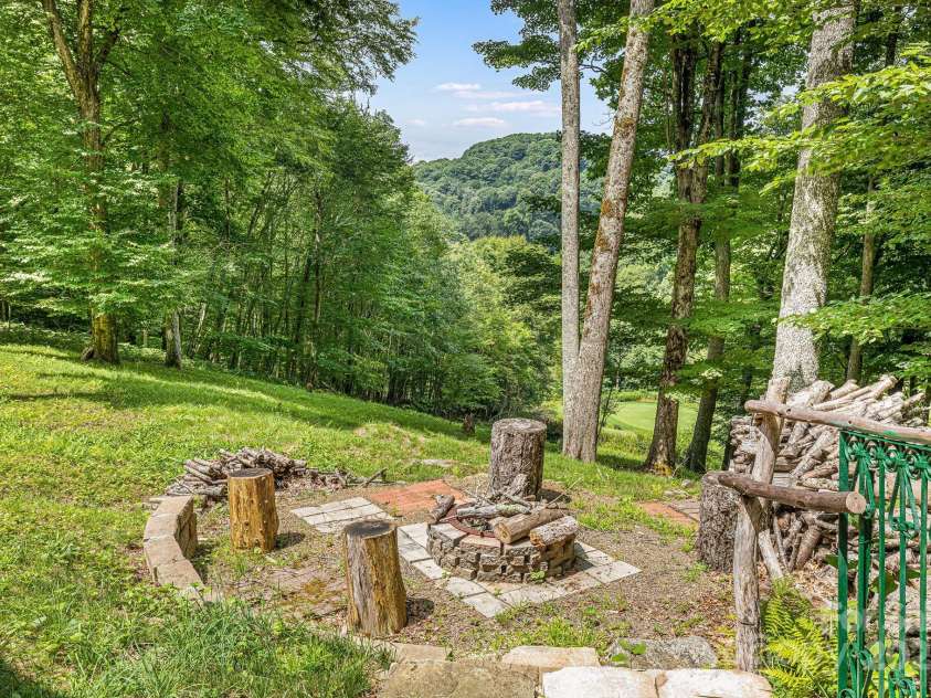 73 Oak Ridge Court, Mars Hill, NC 28754.  MLS# CAR4166537, YatesRealty ID 7165. Fire pit overlooking the golf course.