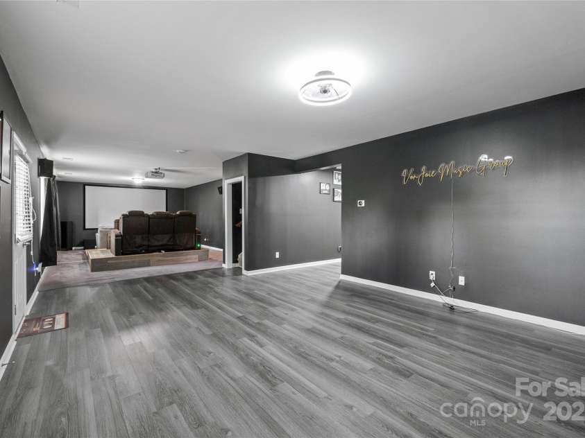 8905 Valleymoon Lane, Charlotte, NC 28214.  MLS# CAR4199406, YatesRealty ID 7165. How about a movie night? Theatre equipment and brown theatre seats remain here for you.