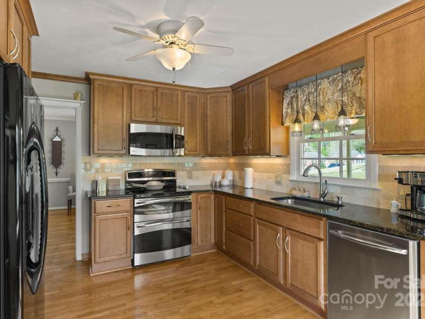 922 Hawthorne Drive, Lenoir, NC 28645.  MLS# CAR4246497, YatesRealty ID 7179. Kitchen1 w/ custom cabinets, counters and stainless appliances