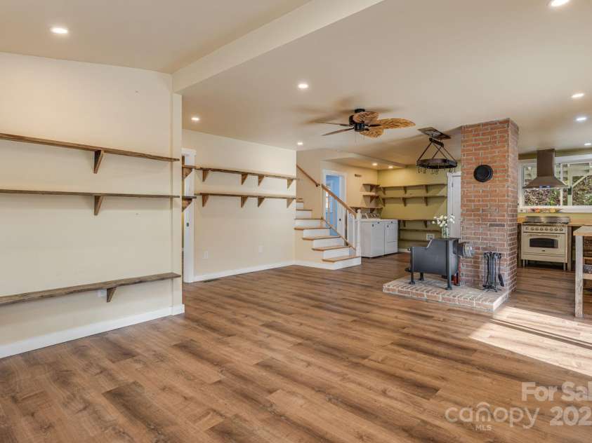 340 Wendy Avenue, Marshall, NC 28753.  MLS# CAR4210108, YatesRealty ID 7191. Living area facing kitchen and staircase