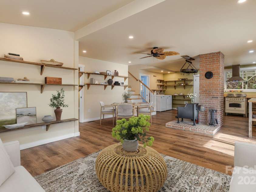 340 Wendy Avenue, Marshall, NC 28753.  MLS# CAR4210108, YatesRealty ID 7191. VIRTUALLY STAGED - Living area facing kitchen and staircase