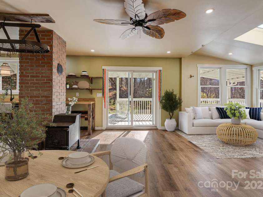 340 Wendy Avenue, Marshall, NC 28753.  MLS# CAR4210108, YatesRealty ID 7191. VIRTUALLY STAGED - Open dining & living area