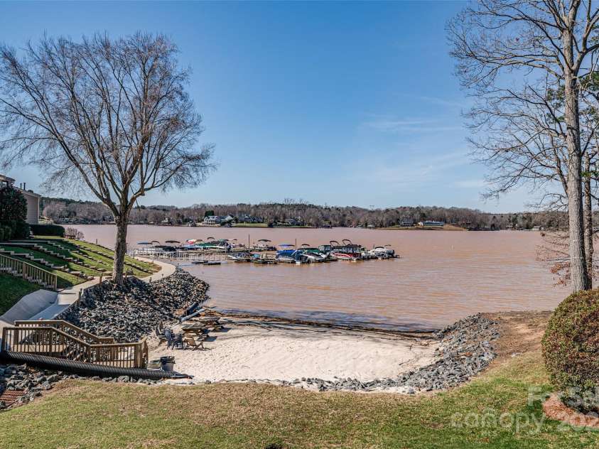 14106 Yachtsman Harbor Drive, Charlotte, NC 28278.  MLS# CAR4221329, YatesRealty ID 7195. Convenient private beach just steps away from the pool and located 500 feet from this townhome.