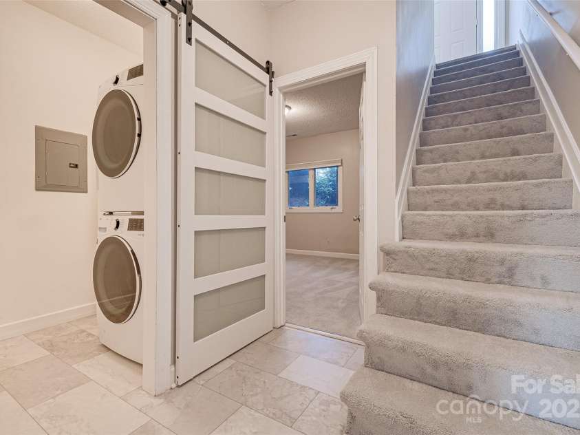 14106 Yachtsman Harbor Drive, Charlotte, NC 28278.  MLS# CAR4221329, YatesRealty ID 7195. New high-end washer and dryer installed August 2022 located in the laundry room behind an upgraded barn door and conveniently located next to the bedrooms.