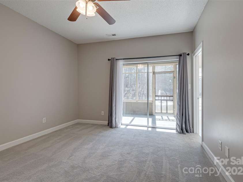 14106 Yachtsman Harbor Drive, Charlotte, NC 28278.  MLS# CAR4221329, YatesRealty ID 7195. This bedroom has a  has keyed sliding glass door entry with screened porch.