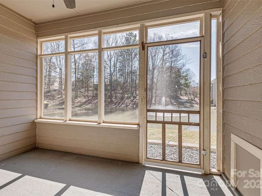 14106 Yachtsman Harbor Drive, Charlotte, NC 28278.  MLS# CAR4221329, YatesRealty ID 7195. Unit overlooks a peaceful pond providing a tranquil setting to enjoy the sounds of the fountain, watch the heron fish and the turtles sunbathe visible from both levels of the home