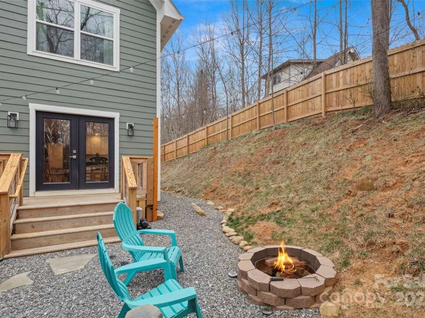 15 Hemlock Drive, Asheville, NC 28806.  MLS# CAR4232491, YatesRealty ID 7197. Fire pit and back yard