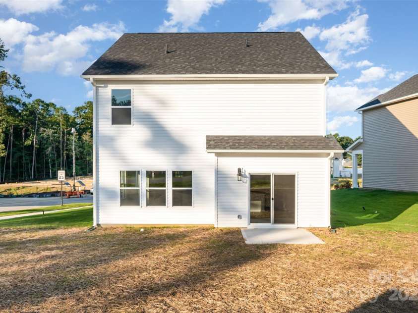 2059 Sadler Woods Lane, Charlotte, NC 28214.  MLS# CAR4265584, YatesRealty ID 720. Back patio. Representational Photo.