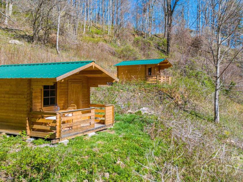 85 Woody Farm Road, Hot Springs, NC 28743.  MLS# CAR4248089, YatesRealty ID 7213. 6 off grid cabins