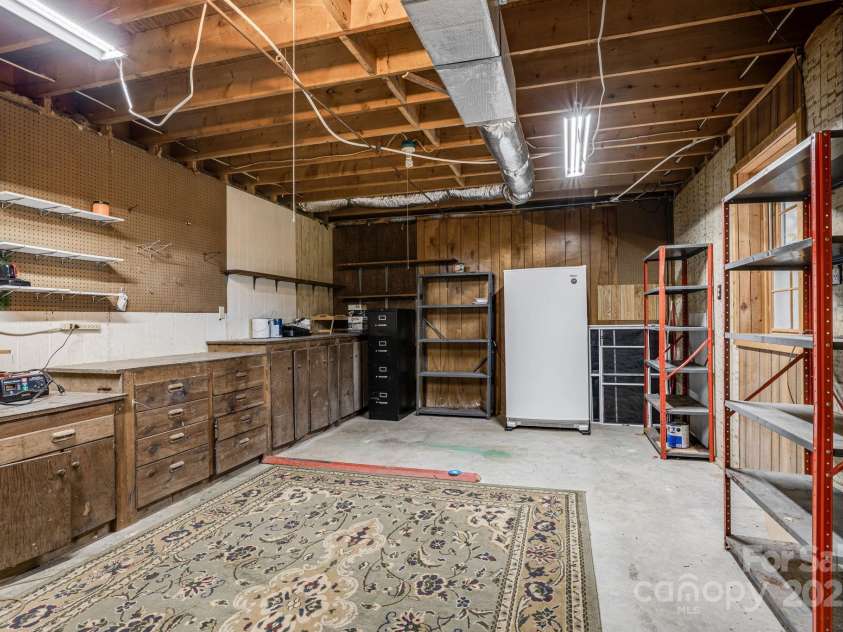 85 Woody Farm Road, Hot Springs, NC 28743.  MLS# CAR4248089, YatesRealty ID 7213. Basement workshop