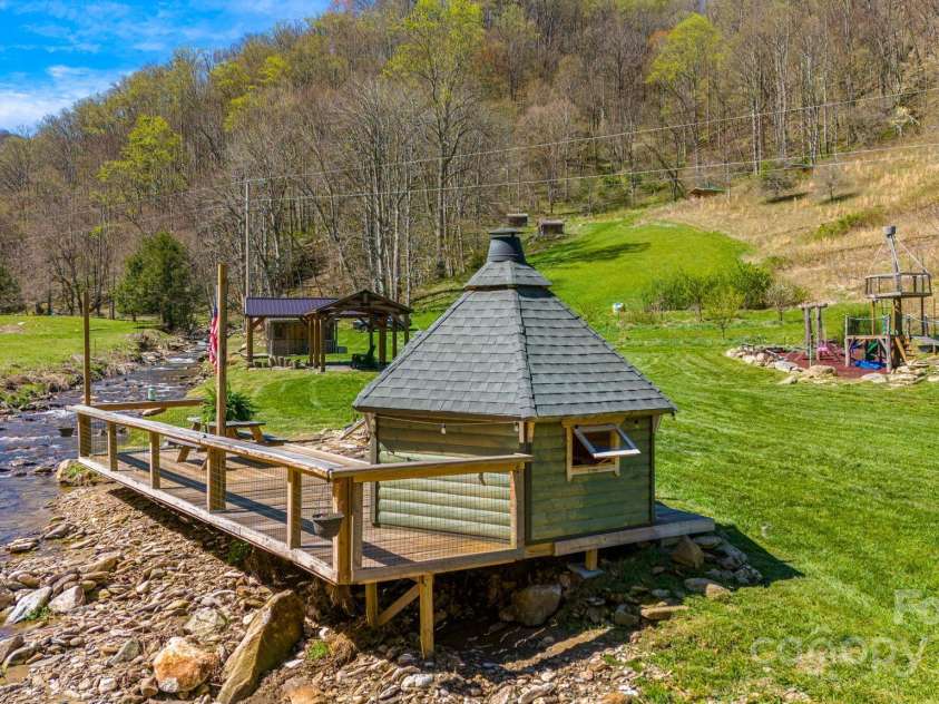 85 Woody Farm Road, Hot Springs, NC 28743.  MLS# CAR4248089, YatesRealty ID 7213. Finnish BBQ Hut by the river
