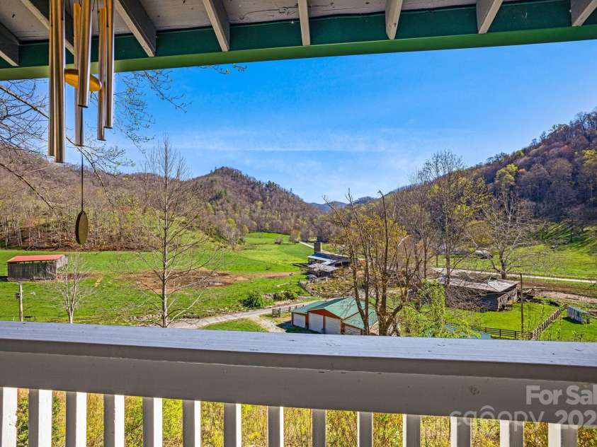 85 Woody Farm Road, Hot Springs, NC 28743.  MLS# CAR4248089, YatesRealty ID 7213. Primary bedroom porch