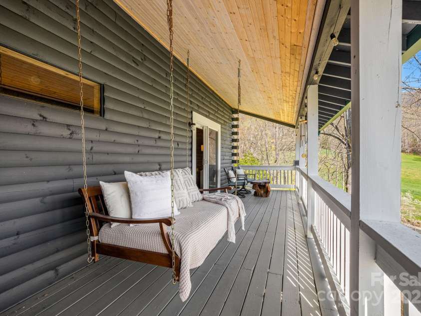 85 Woody Farm Road, Hot Springs, NC 28743.  MLS# CAR4248089, YatesRealty ID 7213. Primary bedroom porch