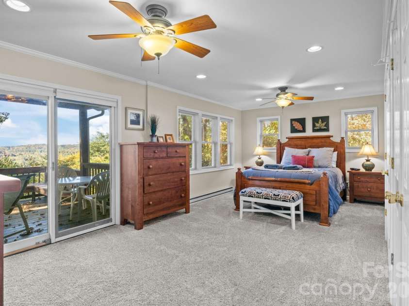265 Dameron Drive, Blowing Rock, NC 28605.  MLS# CAR4325817, YatesRealty ID 7224. Spacious and bright primary suite with access to the back deck and mountain views. 