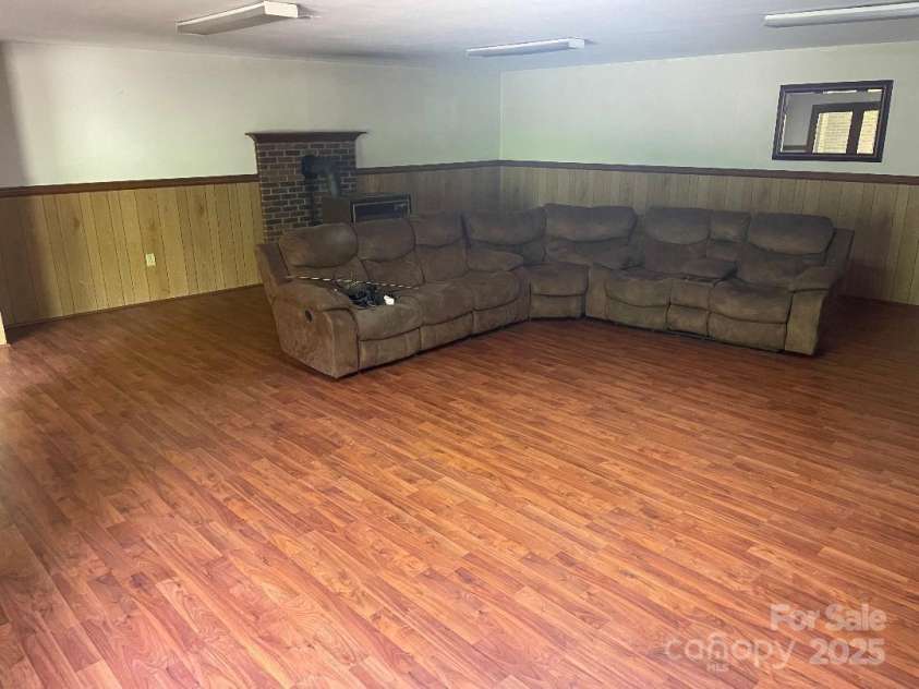 1300 Irish Potato Road, Concord, NC 28025.  MLS# CAR4244013, YatesRealty ID 7225. Family Room Basement 27' X 25'11