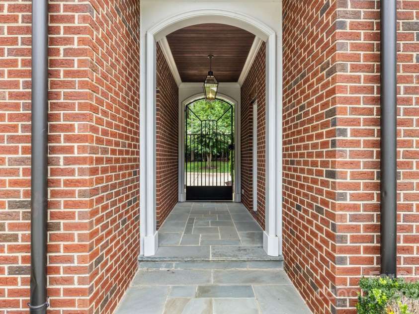 440 Beech Tree Road, Mooresville, NC 28117.  MLS# CAR4293759, YatesRealty ID 7228. Covered Breezeway from garage to pool house. 