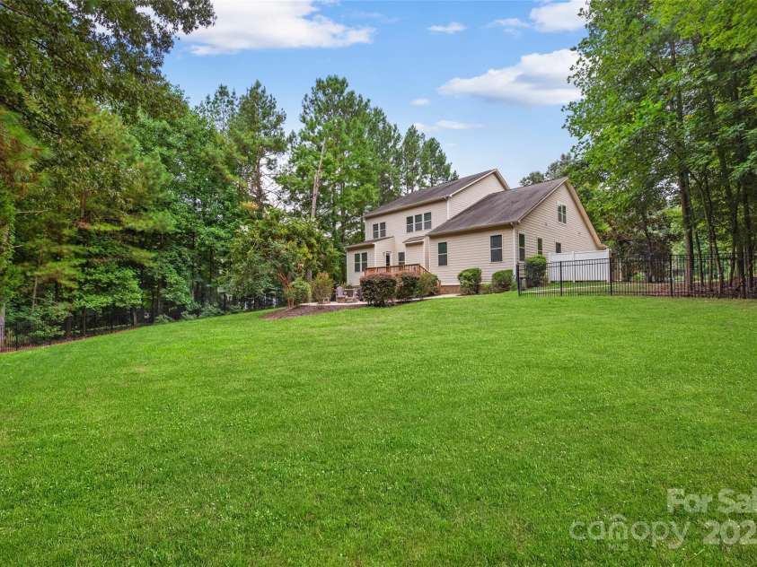 2103 Saddleridge Drive, Waxhaw, NC 28173.  MLS# CAR4305035, YatesRealty ID 723. Lush backyard