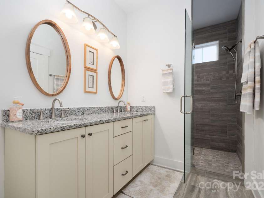 76 Creekside View Drive, Asheville, NC 28804.  MLS# CAR4265172, YatesRealty ID 7234. Lovely Primary Bath with Walk-In Shower