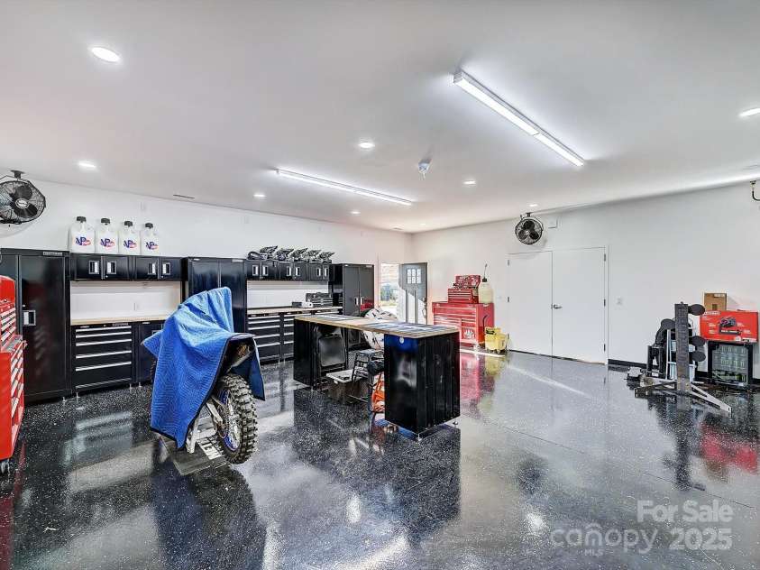 1525 Shinnville Road, Cleveland, NC 27013.  MLS# CAR4249385, YatesRealty ID 7235. Lower Level Conditioned Workshop