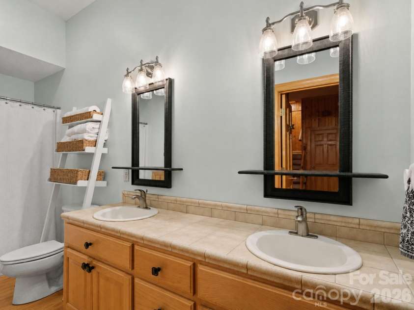 7255 Laurel Hill Drive, Newland, NC 28657.  MLS# CAR4315201, YatesRealty ID 7235. Guest bath features double sinks