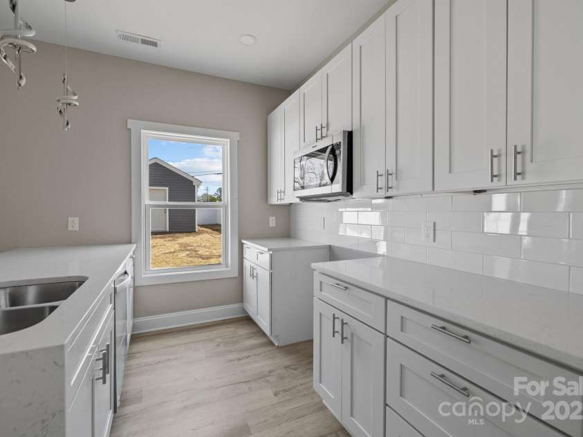 3804 Freedom Drive, Charlotte, NC 28208.  MLS# CAR4245901, YatesRealty ID 7245. Stainless Steel Stove, Microwave, and dishwasher