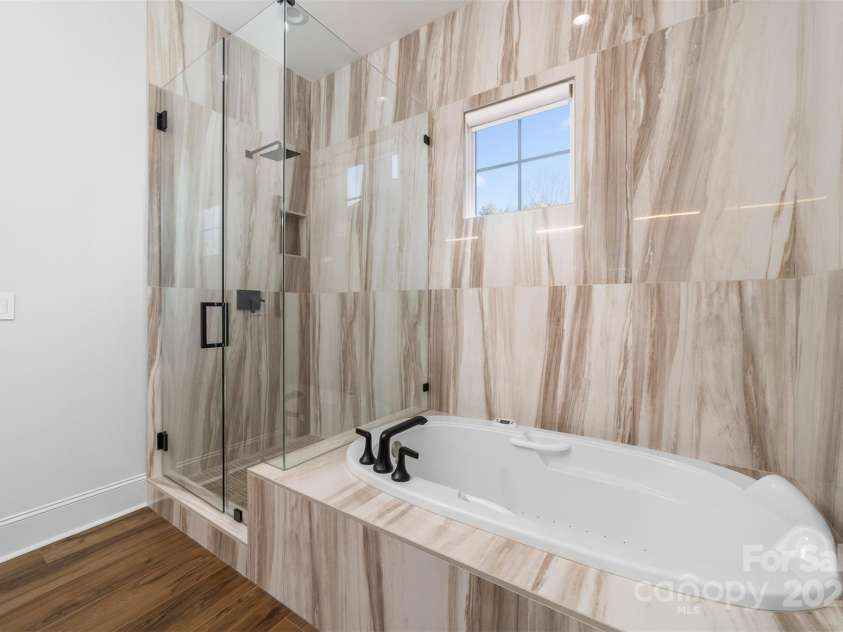 101 Cove Key Lane, Mooresville, NC 28117.  MLS# CAR4233761, YatesRealty ID 7255. Jetted Tub and Frameless Glass Shower