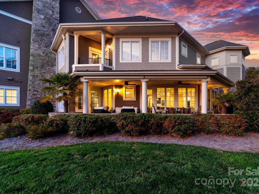 101 Cove Key Lane, Mooresville, NC 28117.  MLS# CAR4233761, YatesRealty ID 7255. Wrap around Porch with Motorized Shades for Privacy