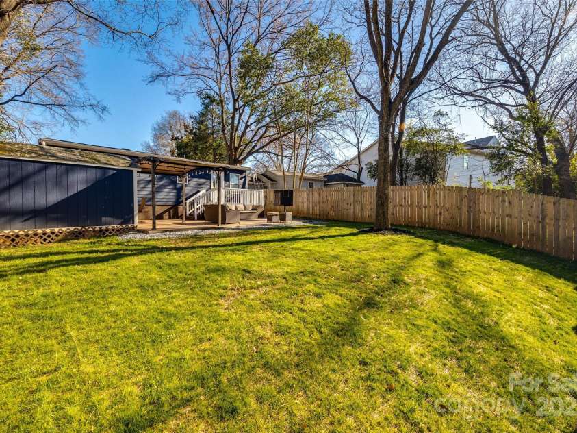 119 Smallwood Place, Charlotte, NC 28216.  MLS# CAR4221901, YatesRealty ID 7260. Huge cleared, flat, grassy, full privacy fenced backyard