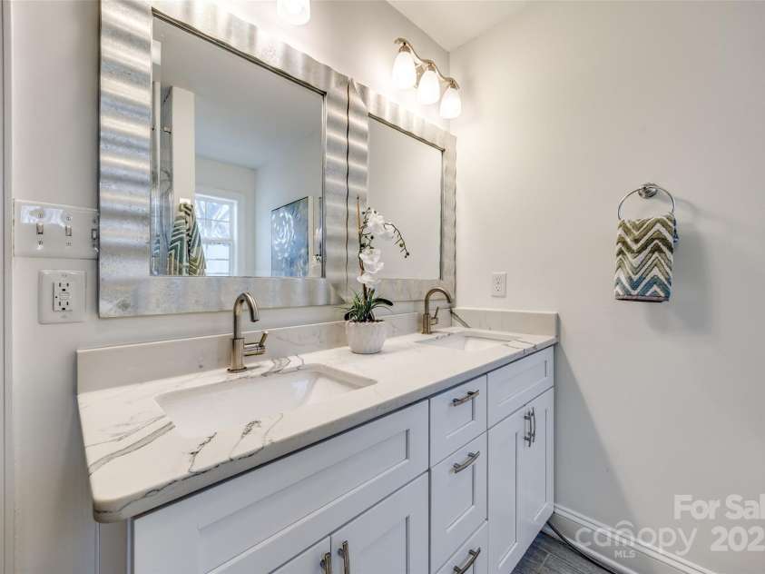 119 Smallwood Place, Charlotte, NC 28216.  MLS# CAR4221901, YatesRealty ID 7260. Primary Bathroom with updated dual vanities