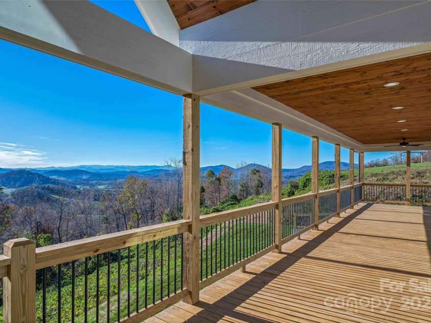 53 McKinley Drive, Hendersonville, NC 28792.  MLS# CAR4197454, YatesRealty ID 7263. Enjoy time well spent outdoors on the covered back deck.