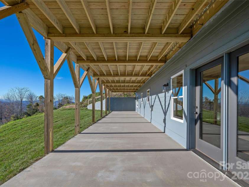 53 McKinley Drive, Hendersonville, NC 28792.  MLS# CAR4197454, YatesRealty ID 7263. Lower level patio, ideal for outdoor living and your hot tub.