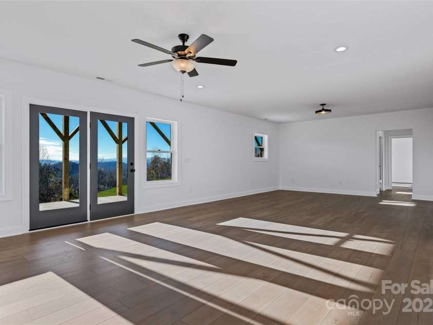 53 McKinley Drive, Hendersonville, NC 28792.  MLS# CAR4197454, YatesRealty ID 7263. Lower level recreation room with views and spacious proportions.
