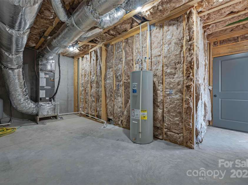 53 McKinley Drive, Hendersonville, NC 28792.  MLS# CAR4197454, YatesRealty ID 7263. Neat and tidy mechanical room with abundant storage potential.