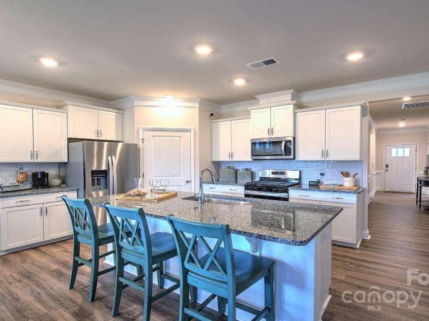 571 Fox Cove Road, Hendersonville, NC 28792.  MLS# CAR4199127, YatesRealty ID 7266. Kitchen island/breakfast bar, spacious pantry.