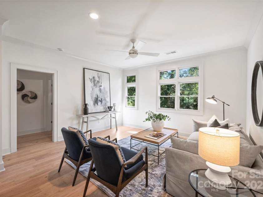 2023 Thurmond Place, Charlotte, NC 28205.  MLS# CAR4206034, YatesRealty ID 7271. Living Room. Representative from last completed unit.