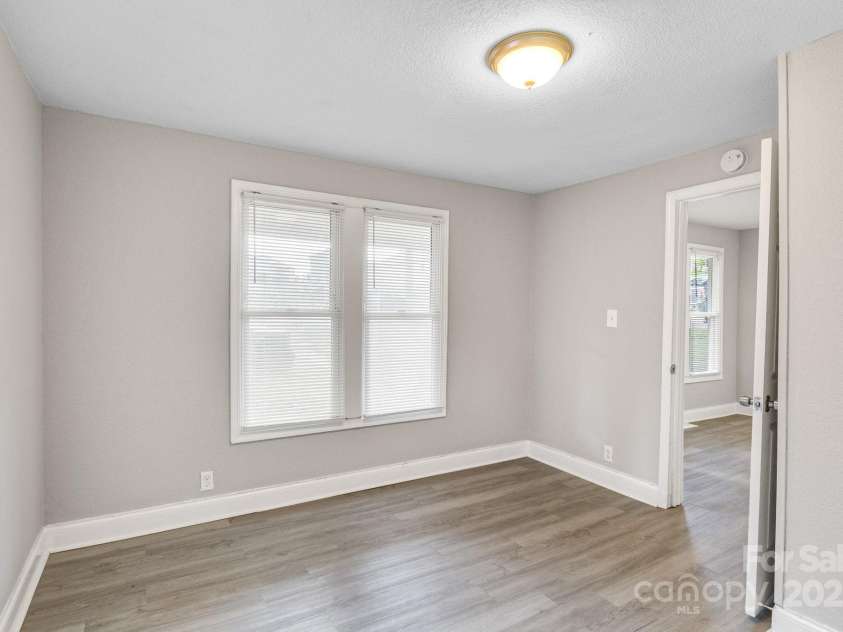 4229 Plato Circle, Charlotte, NC 28208.  MLS# CAR4303896, YatesRealty ID 7273. Second bedroom facing entry into living room.