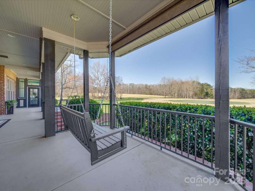 810 Lake Wright Road, China Grove, NC 28023.  MLS# CAR4236007, YatesRealty ID 7274. Back porch looking over #2 Hole at Warrior