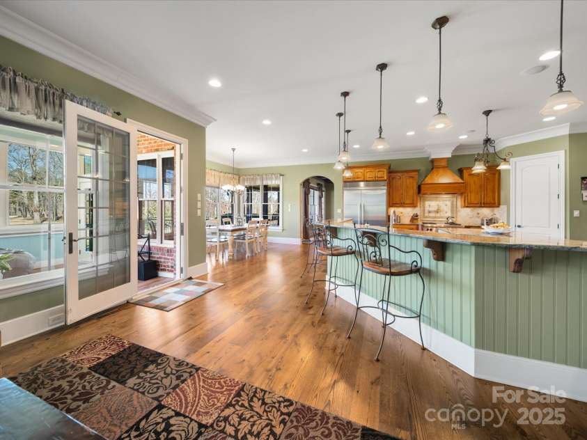 810 Lake Wright Road, China Grove, NC 28023.  MLS# CAR4236007, YatesRealty ID 7274. From hearth room looking toward kitchen and breakfast area