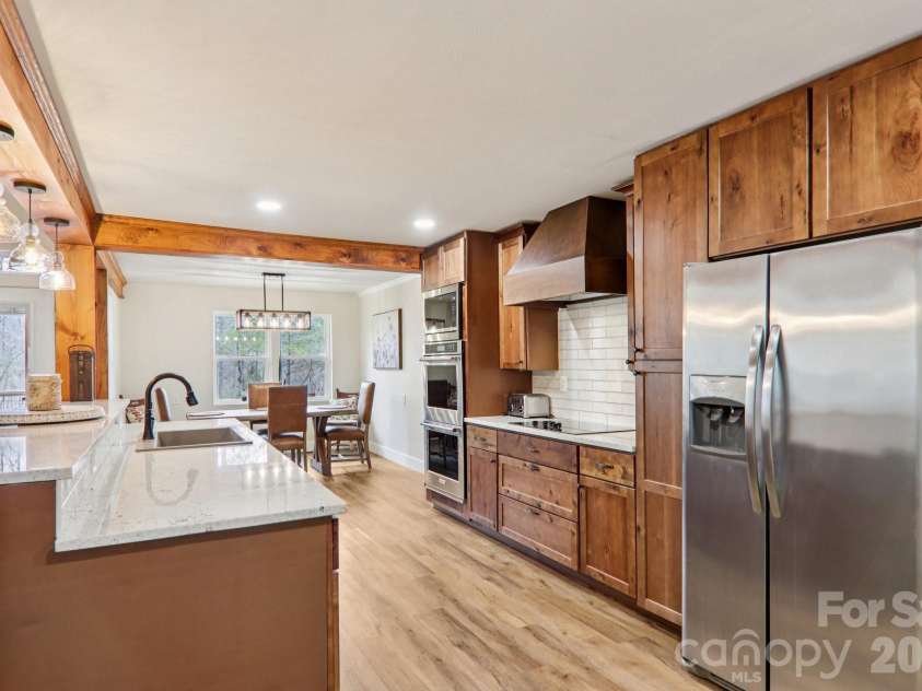 159 Broken Bow Run, Pickens, SC 29671.  MLS# CAR4355826, YatesRealty ID 7277. Bar height counter with stone countertops