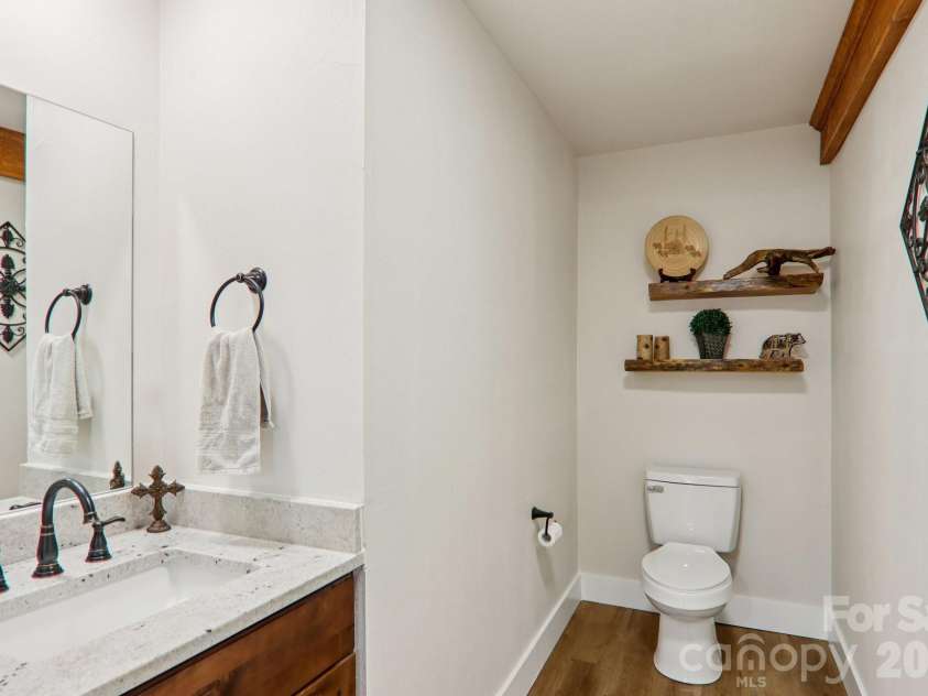159 Broken Bow Run, Pickens, SC 29671.  MLS# CAR4355826, YatesRealty ID 7277. Half-bath adjacent to garage entrance and pantry