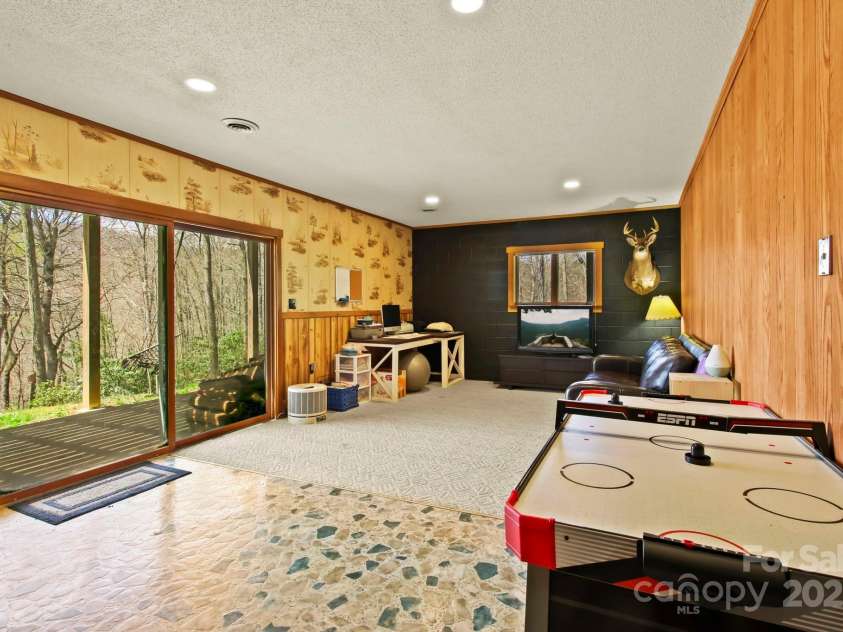 675 Rodgers Road, Newland, NC 28657.  MLS# CAR4247976, YatesRealty ID 7278. Basement Family Room with Walk Out
