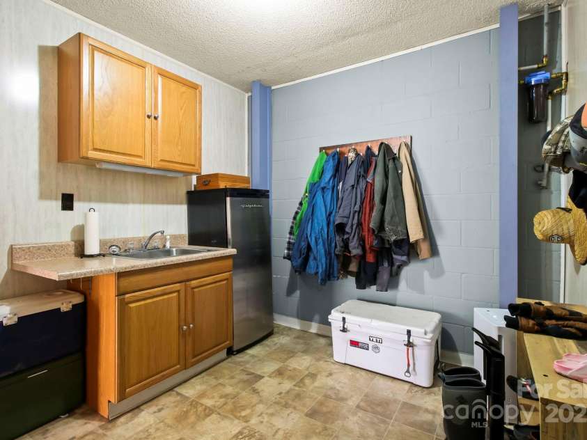 675 Rodgers Road, Newland, NC 28657.  MLS# CAR4247976, YatesRealty ID 7278. Garage Entrance to Mudroom/Second Kitchen Area