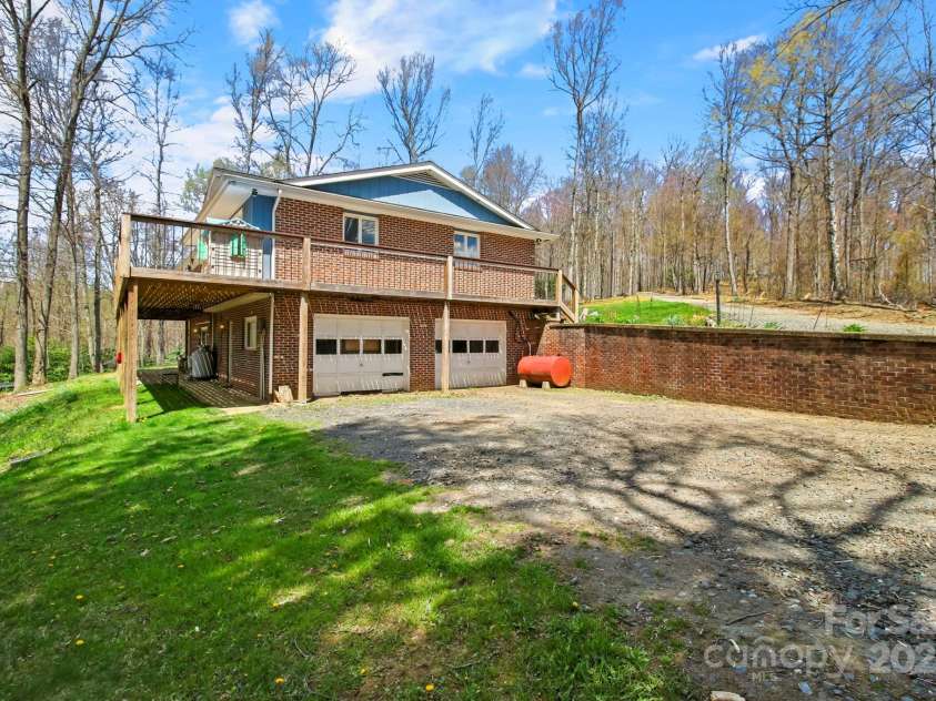 675 Rodgers Road, Newland, NC 28657.  MLS# CAR4247976, YatesRealty ID 7278. Lower Driveway to Two Car Garage