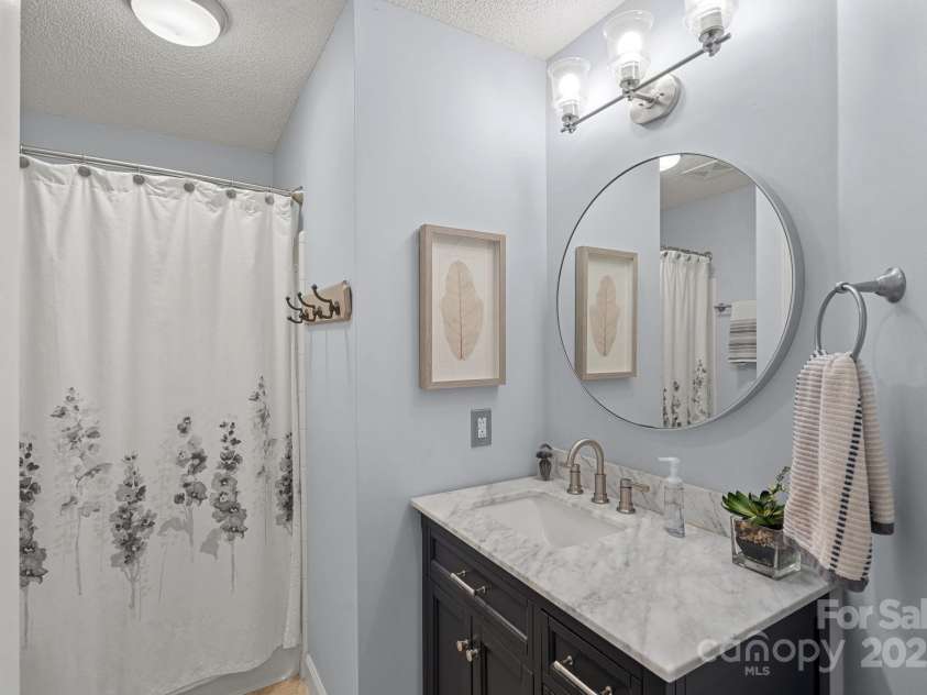 18673 Vineyard Point Lane, Cornelius, NC 28031.  MLS# CAR4304658, YatesRealty ID 729. Full guest bathroom with linen storage closet.