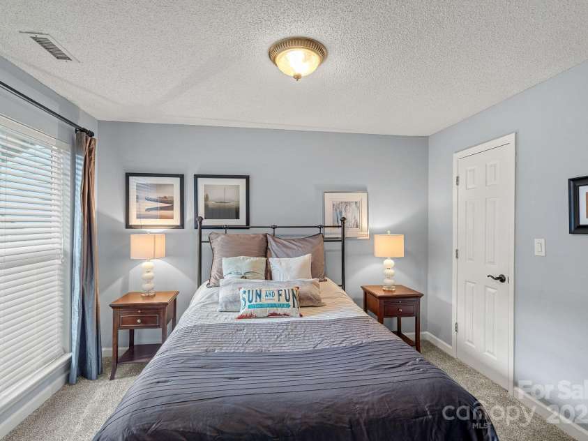 18673 Vineyard Point Lane, Cornelius, NC 28031.  MLS# CAR4304658, YatesRealty ID 729. Guest bedroom #1 with walk-in closet.