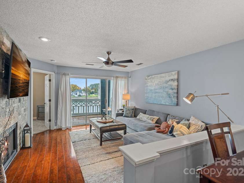 18673 Vineyard Point Lane, Cornelius, NC 28031.  MLS# CAR4304658, YatesRealty ID 729. Relax indoor by the cozy fireplace, or outdoor gazing out at the marina.