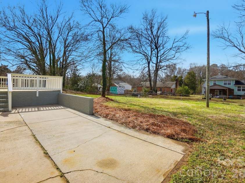 311 Red Roan Place, Charlotte, NC 28215.  MLS# CAR4329511, YatesRealty ID 7295. Additional concrete for parking.