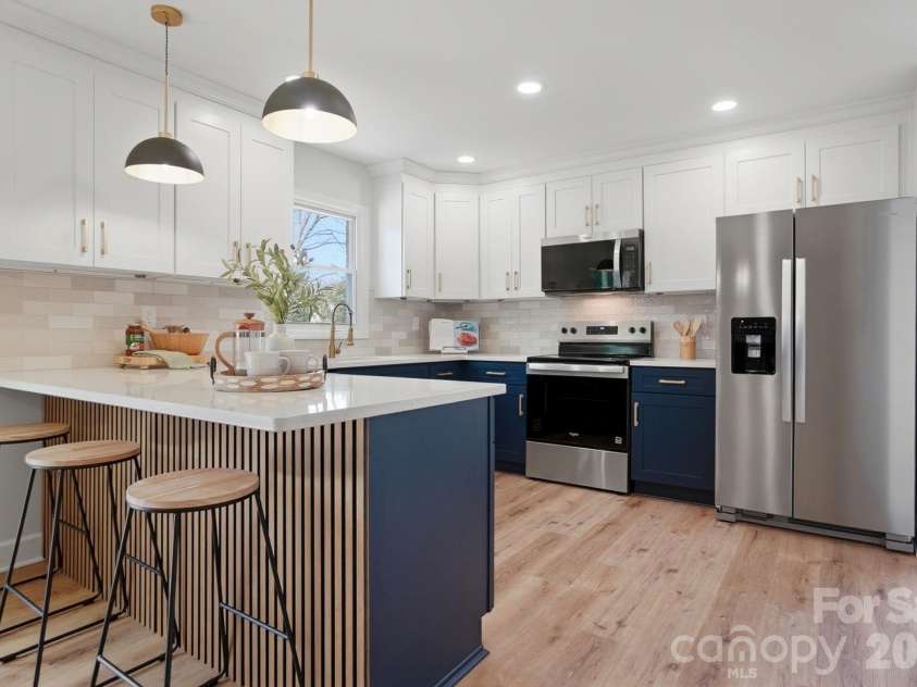 311 Red Roan Place, Charlotte, NC 28215.  MLS# CAR4329511, YatesRealty ID 7295. Kitchen providing ample cabinet space and counter space for functionality.
